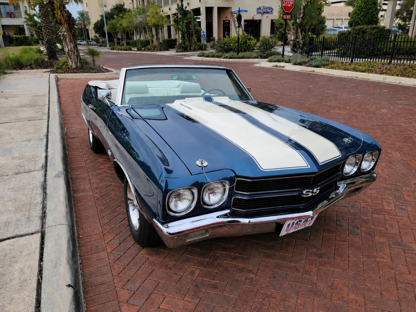 Blue 1970 Chevrolet Chevelle SS convertible with white racing stripes and a white interior